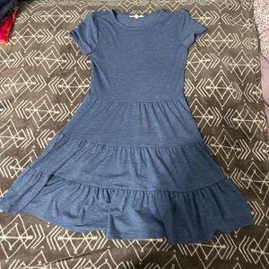 Dusty blue, tiered/A-line dress. Tighter top, flowy bottom, higher neckline